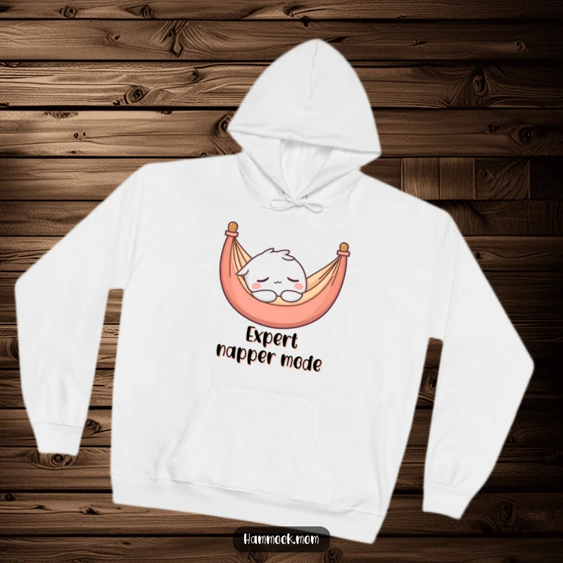 Funny hoodie showcasing a kawaii hammock character in a deep, peaceful sleep, radiating warmth and ultimate relaxation.