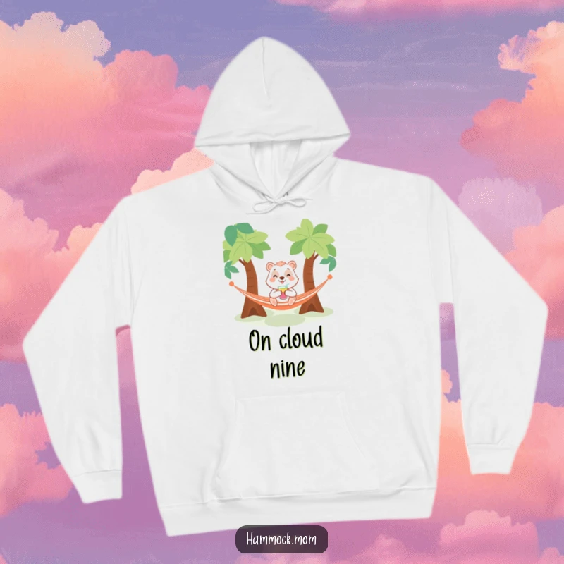 Funny hoodie featuring a smiling animal with a beverage, deeply relaxed in a hammock between trees, promoting a chilled-out vibe.