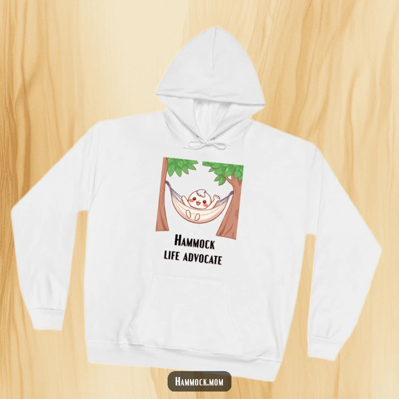 Funny Hoodie: An adorable kawaii character waves with joy from a suspended hammock, promoting ultimate comfort.