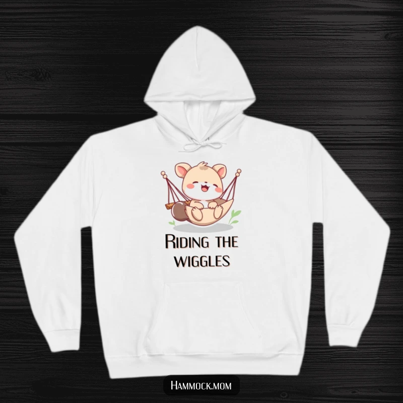 Funny hoodie with a playful animal character laughing heartily as their hammock sways precariously, capturing a moment of pure, giggly fun.